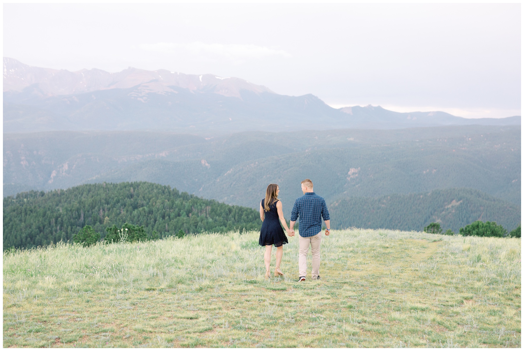 landscape mountain view couple holding hands walking away | Cat Murphy Photography
