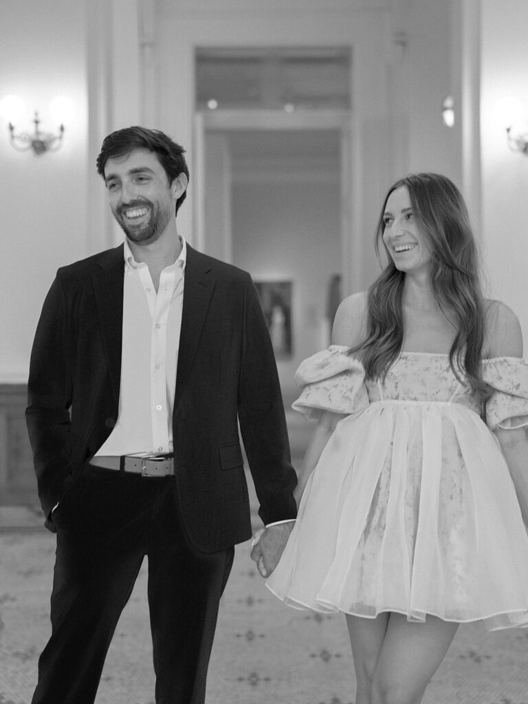 Couple standing inside the Gibbes Art Museum during a Charleston engagement session
