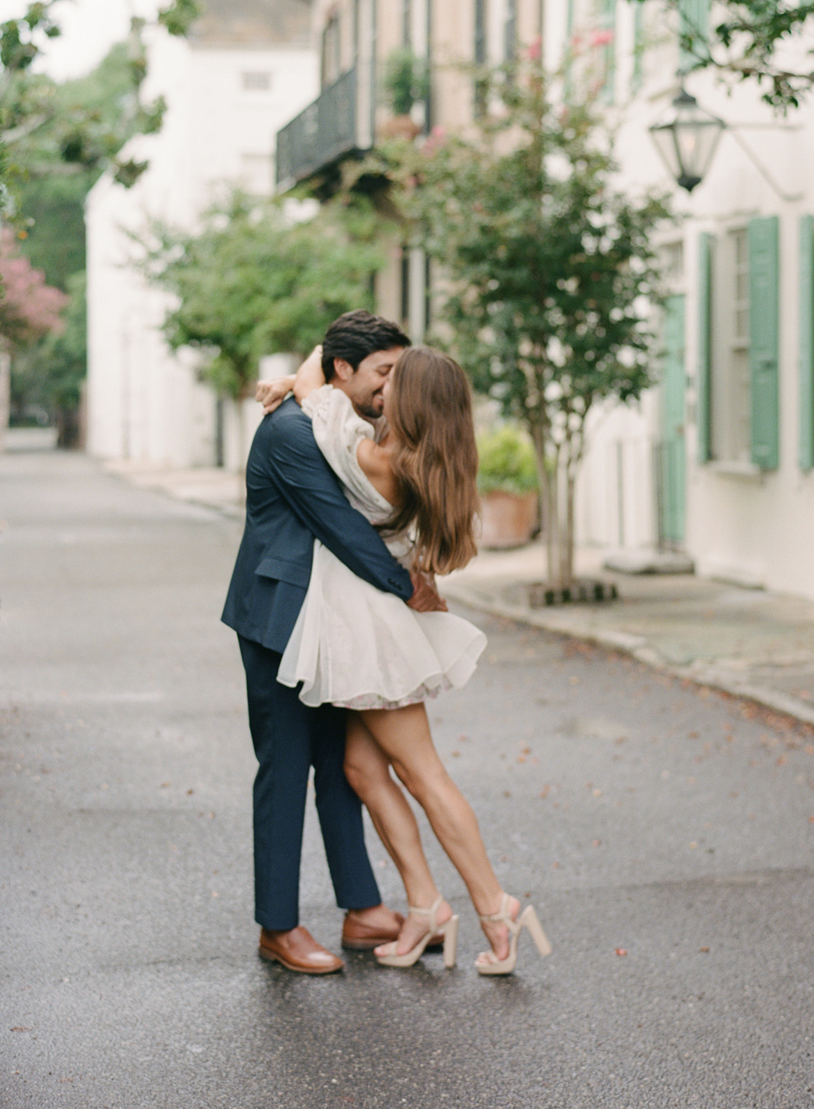 Engagement session in downtown Charleston with cypress trees