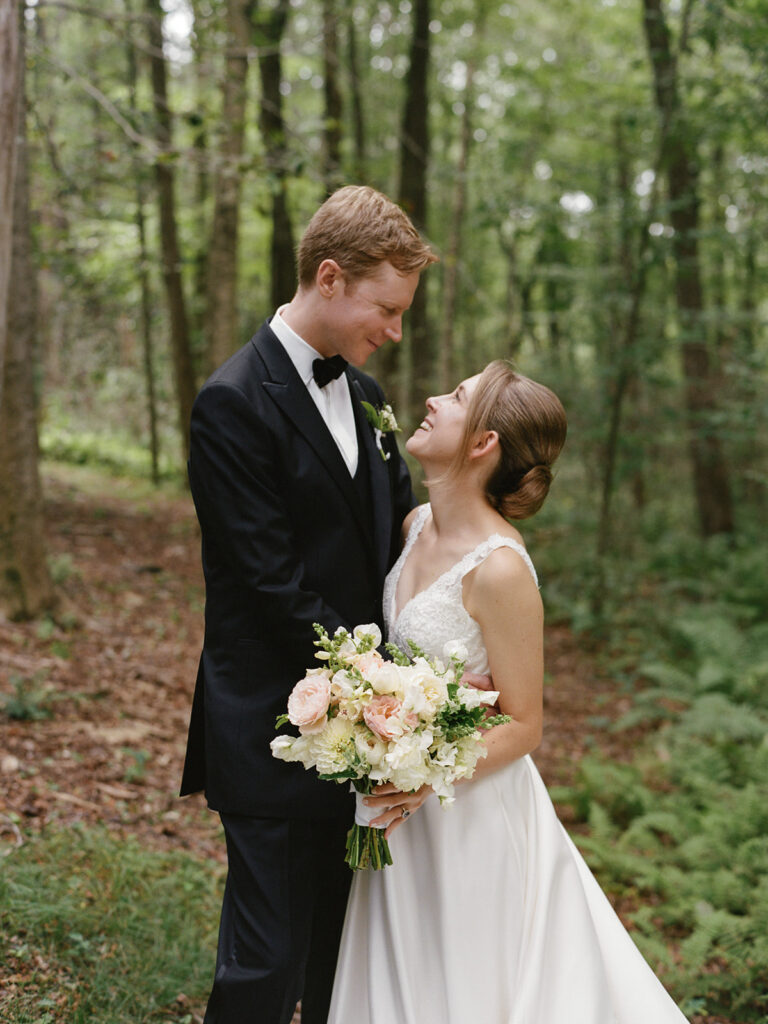 bride and groom portrait in wooded area at Connecticut wedding