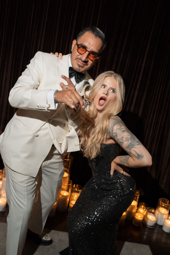 Guests posing at Engage Summit Santa Barbara dessert party with candlelight