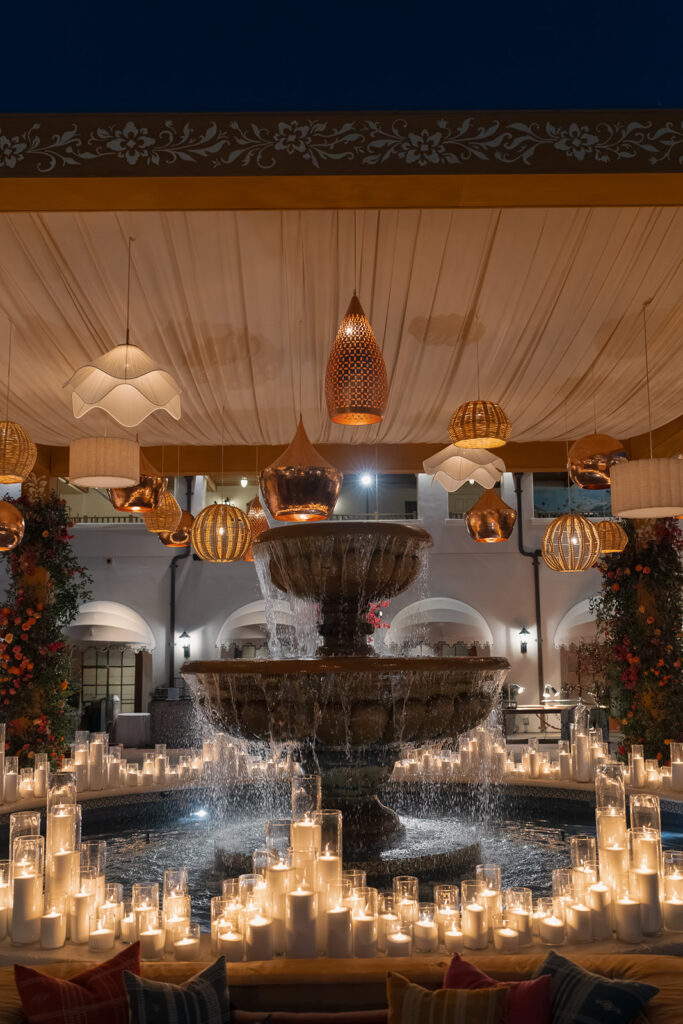 Candlelit fountain installation at Engage Summit Santa Barbara dessert party
