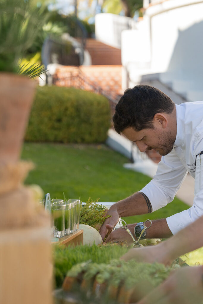Chef preparing food at Engage Summit Santa Barbara outdoor event