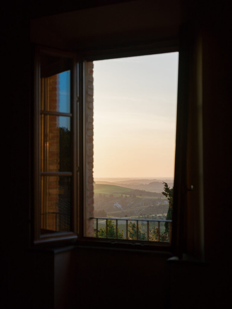 Window view of sunset in Tuscany during Engage Summit event