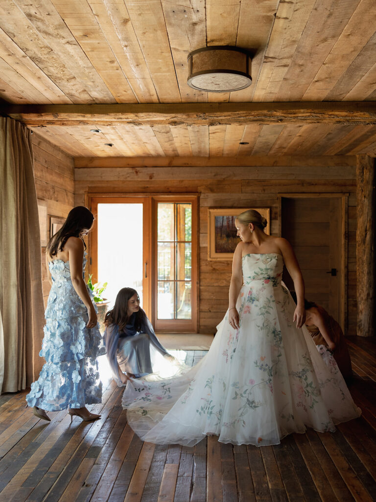 bride getting ready in wood cabin at Mountain Sky Guest Ranch Montana