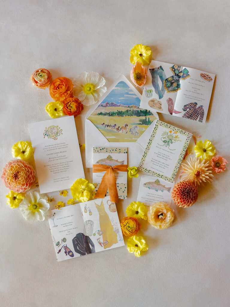 western inspired wedding invitation suite with flowers and paper goods