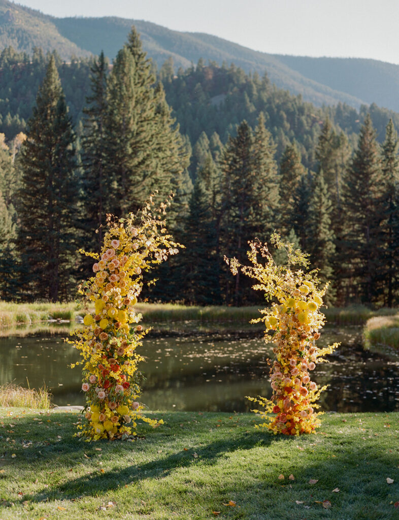 ceremony florals by water at Mountain Sky Guest Ranch wedding