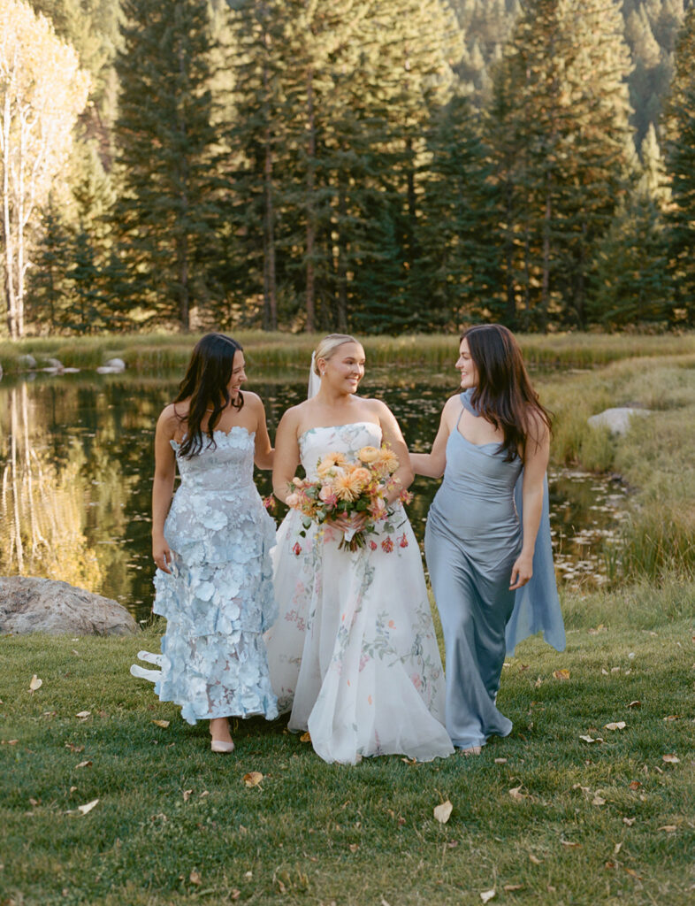 bridal party walking by river at Mountain Sky Guest Ranch Bozeman Montana