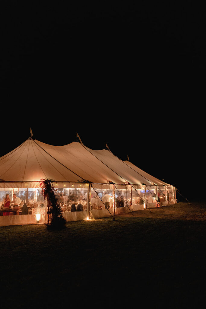 sailcloth tent glowing at night at Aspen wedding