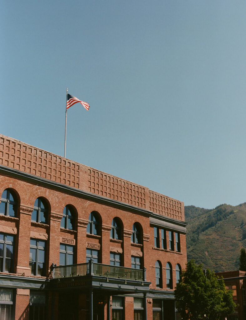 Hotel Jerome exterior in Aspen Colorado with mountain backdrop