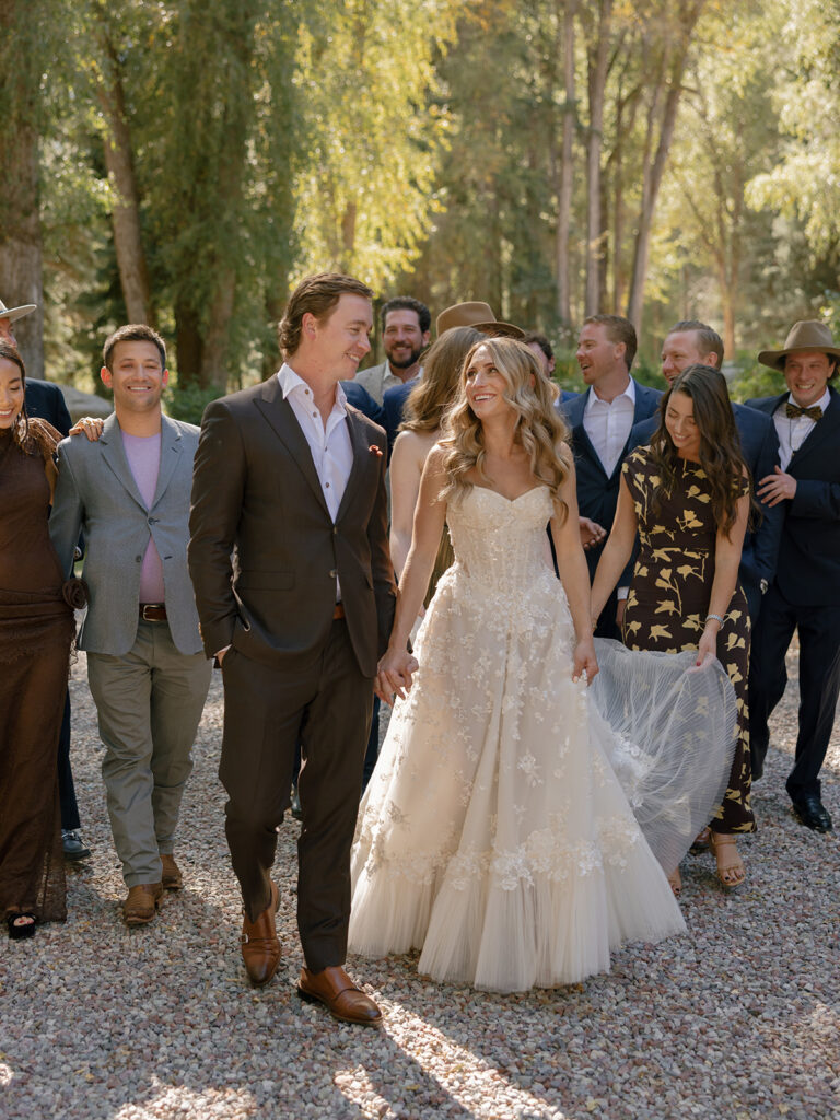 wedding party walking together at Aspen Colorado wedding