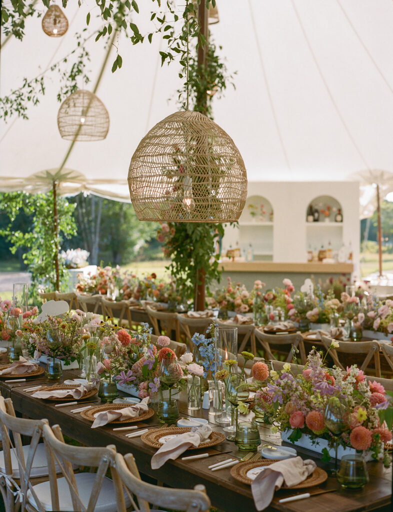 reception tables with woven chargers and florals at Catamount Ranch