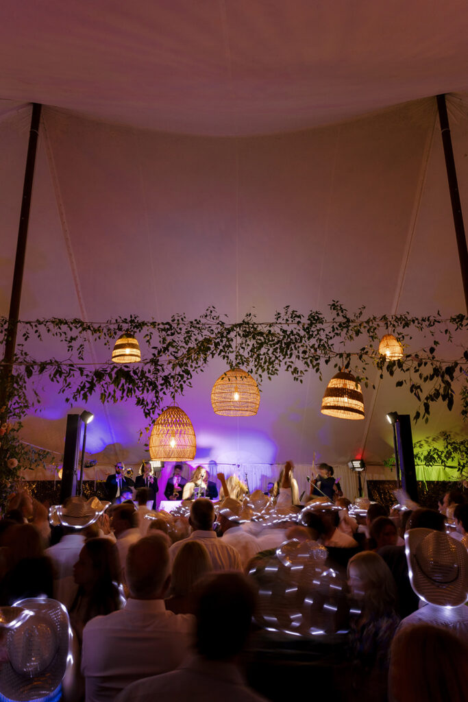 guests dancing with cowboy hats at Steamboat Springs wedding