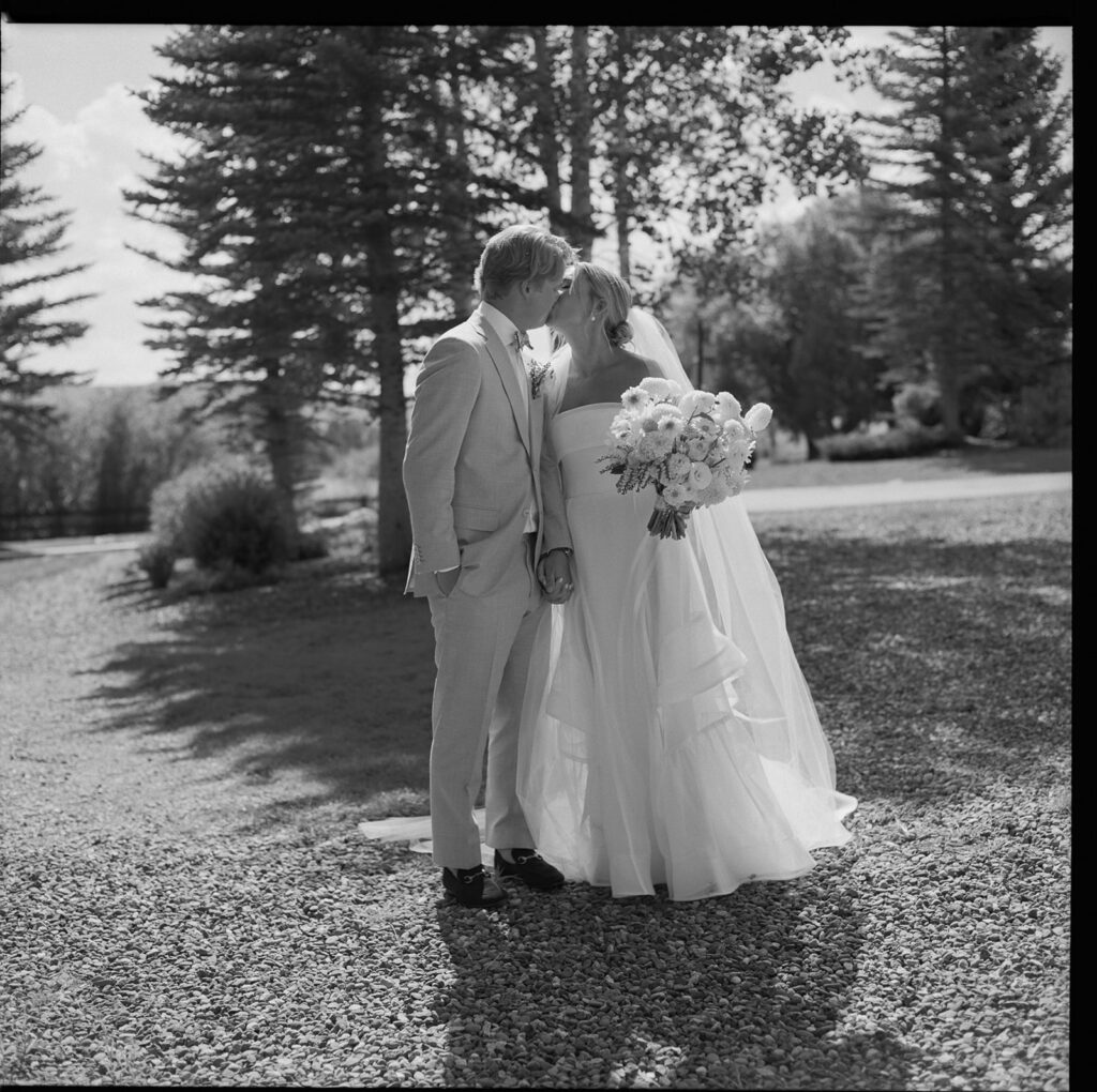 couple walking at sunset along lake in Steamboat Springs