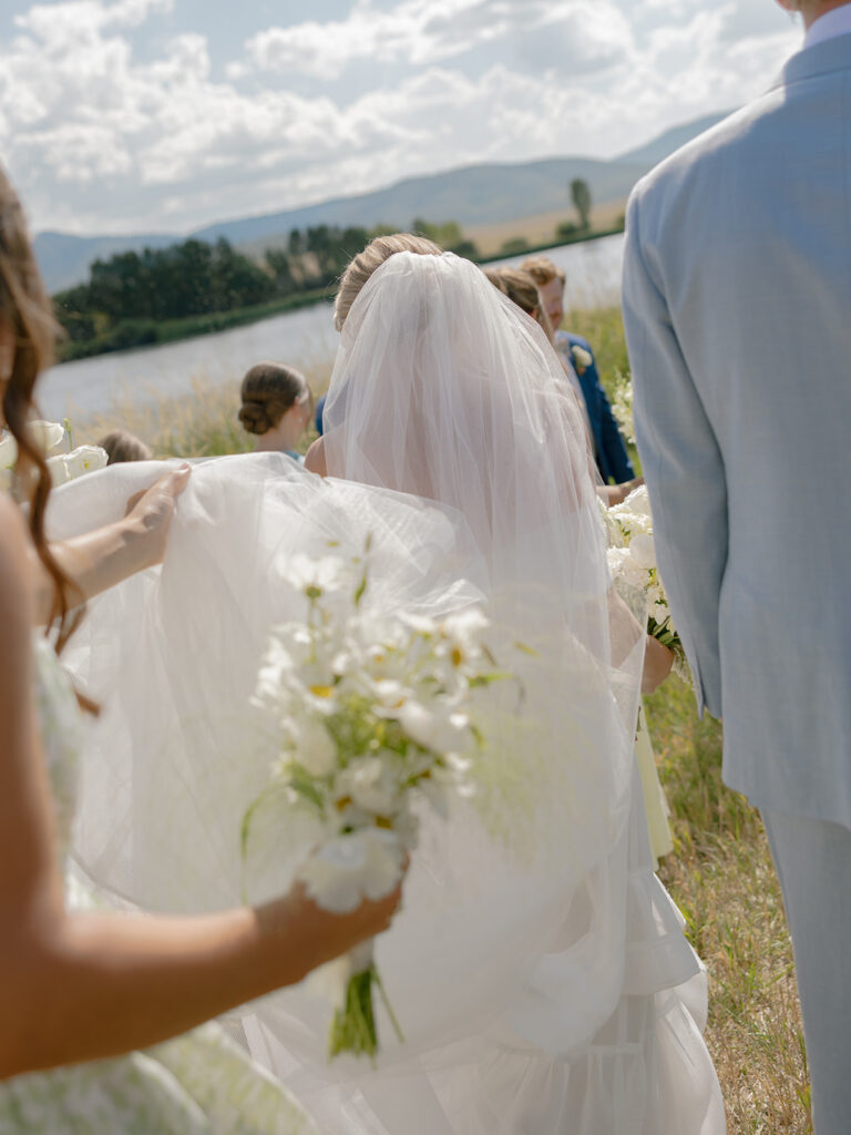 bride and groom portrait by lake at Catamount Ranch wedding