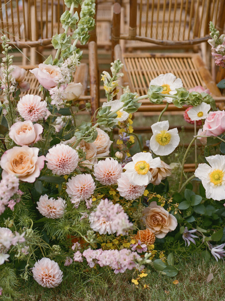 ceremony aisle flowers in pastel tones at Dunlin Auberge