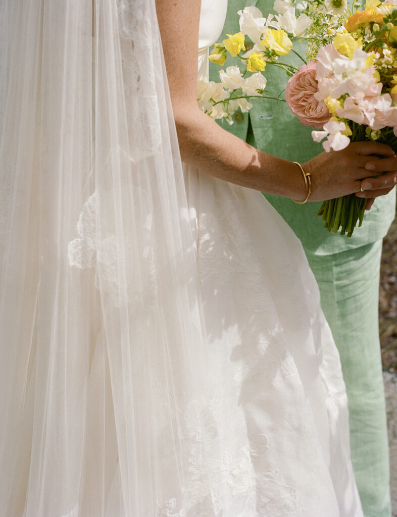 close-up of bouquet and dress at Dunlin Auberge wedding