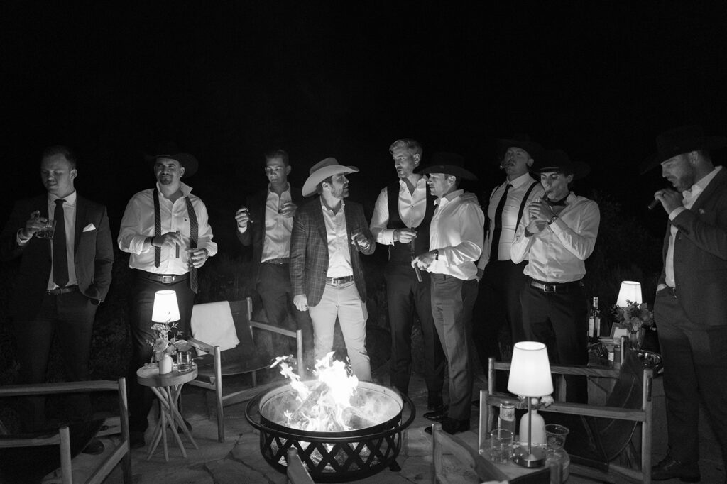 Guests gathered around fire pit at Aspen wedding reception
