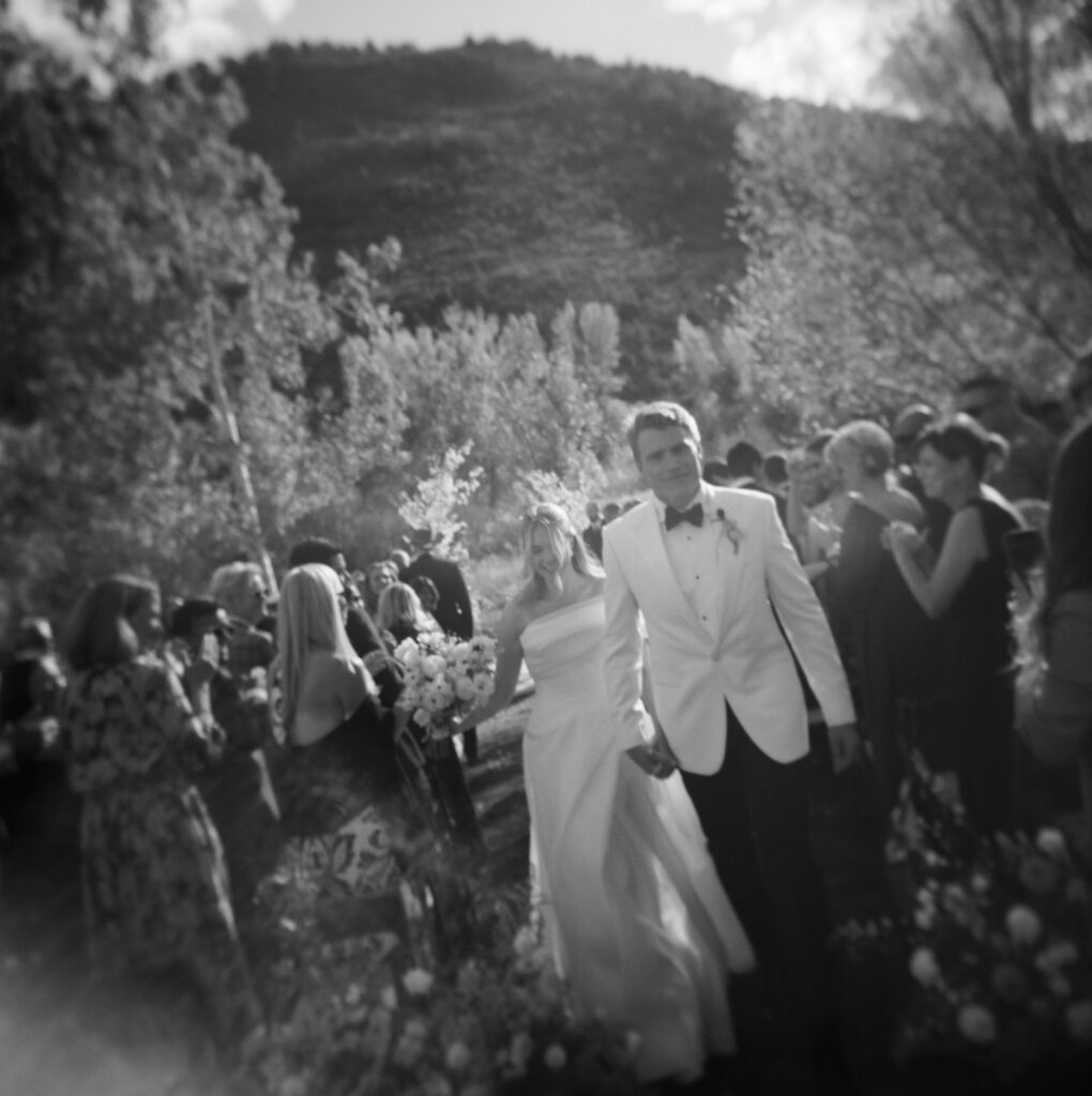 couple walking down aisle after ceremony Aspen wedding