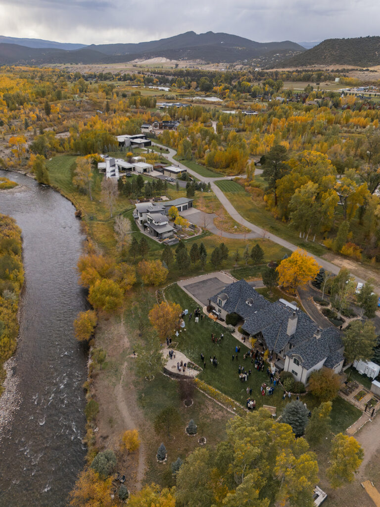 aerial view of Aspen private residence wedding with river and fall trees