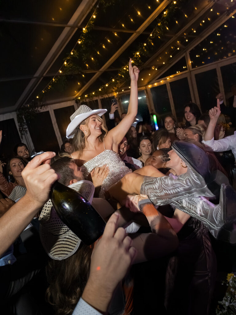bride lifted on dance floor during Aspen wedding