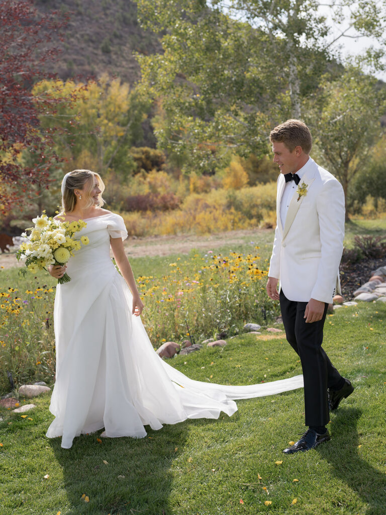 couple portrait near river with fall trees Aspen Colorado