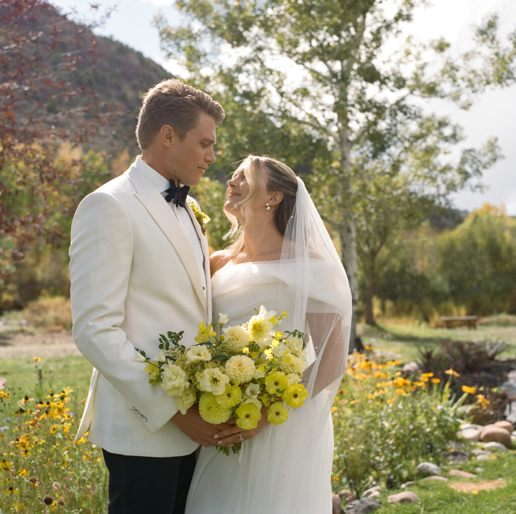 bride and groom portrait holding bouquet at Aspen wedding