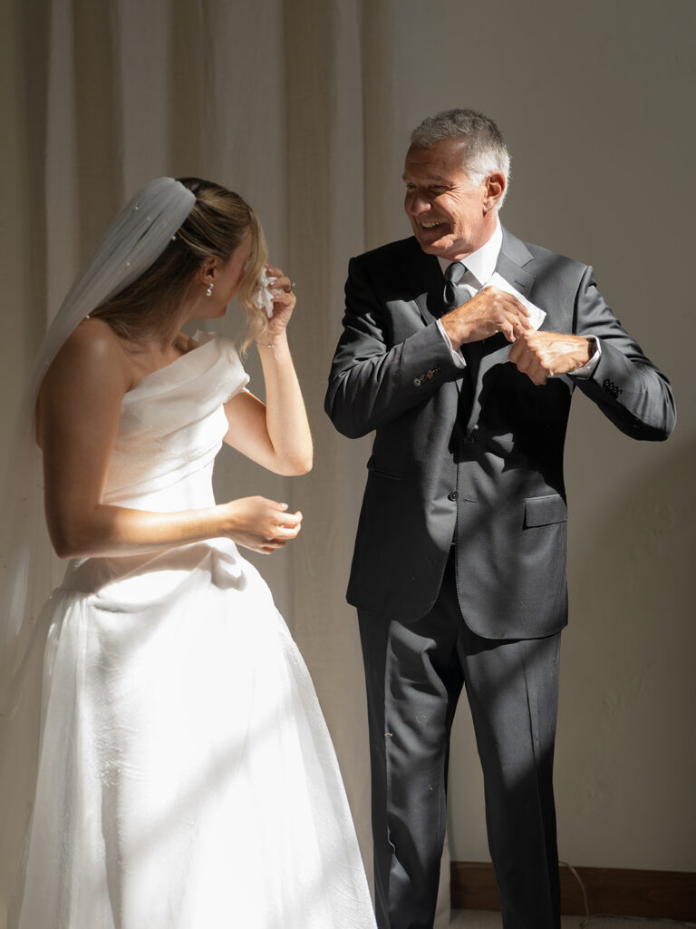bride and father candid moment during wedding day