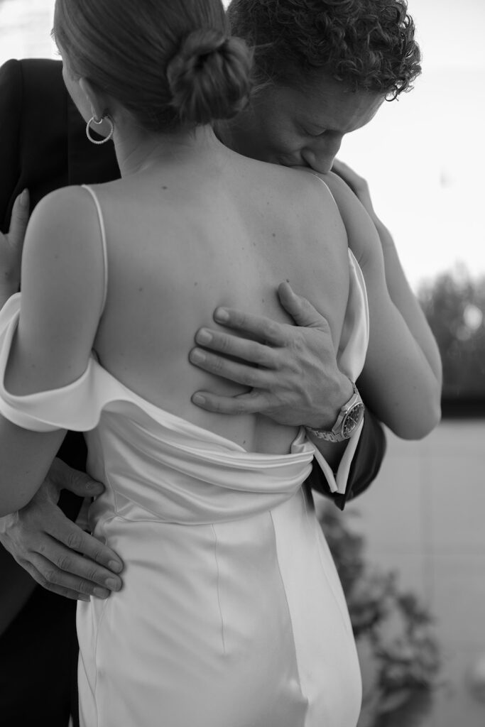 black and white close-up of couple embracing
