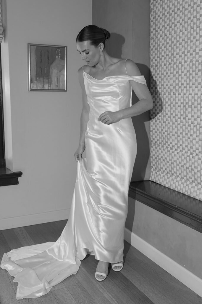 bride adjusting dress during getting ready LA wedding